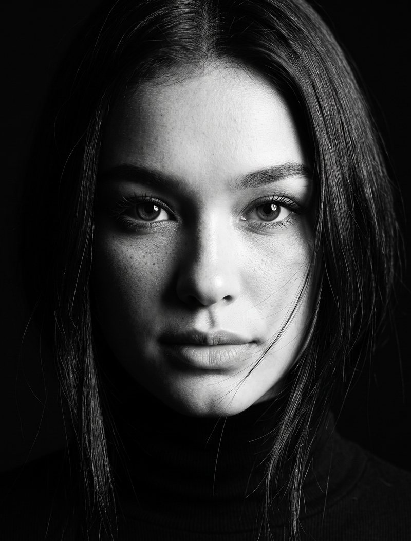 Nova Rai in a black and white portrait under one hard light, a second take